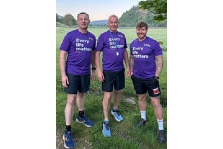 Three adults wearing tshirts that say every life matters