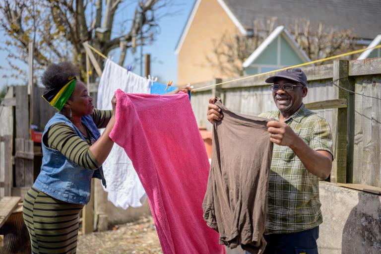A couple hanging their washing