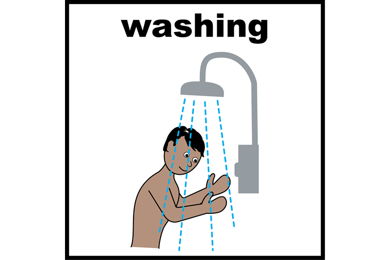 A person standing under a shower, washing themselves