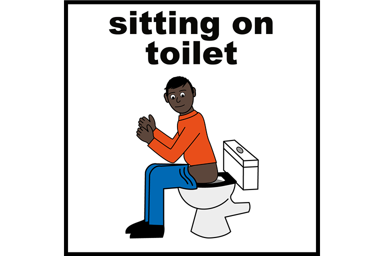 A person sat on the toilet