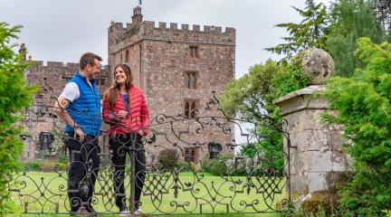 A couple outside Muncaster Castle