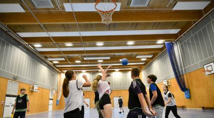 Group of young people playing basketball