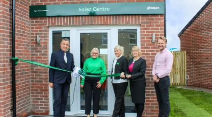 Cllr Emma Williamson with representatives of Gleeson Homes stood behind green ribbon unveiling new development