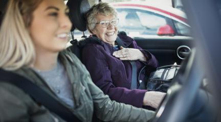 Young woman driving car