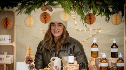 A woman at a Christmas market stand