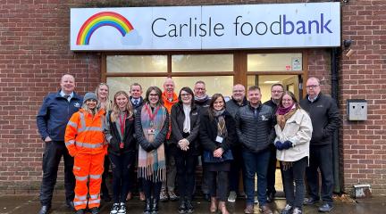 Members of the Carlisle Southern Link Road supply chain making a donation of supplies to Carlisle Foodbank