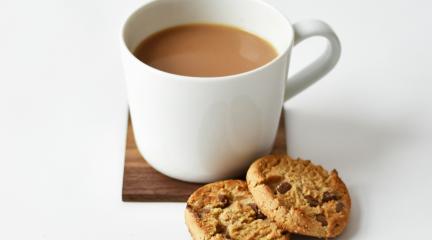 a cup of tea with biscuits