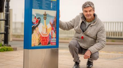 Alan Roper with Maryport signage