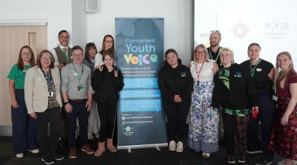 Young people from Unique Voices, along with directors, councilors and officers from Cumberland Council.
