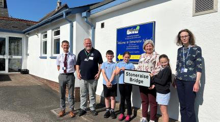 CSLR team and Stoneraise School name plate for Stoneraise Bridge