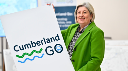 Denise Rollo with Cumberland Go poster