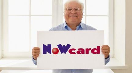 Man holding a now card