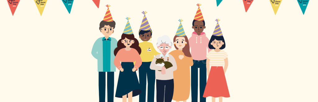 Shared Lives Week 2023 June 26-30, group of smiling people in party hats stand under bunting