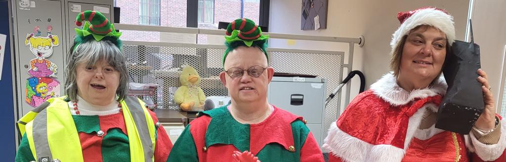 Dragonfly drama's cast in dress rehearsal wearing festive clothing and holding props