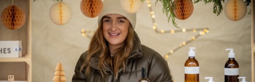 A woman at a Christmas market stand