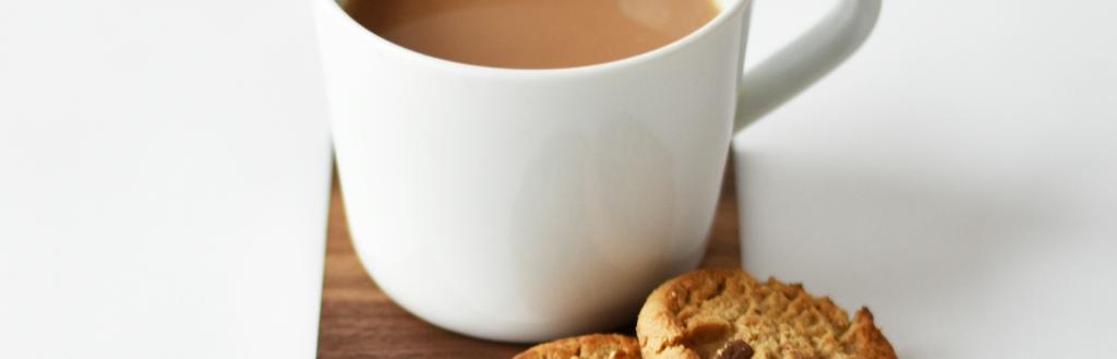 a cup of tea with biscuits