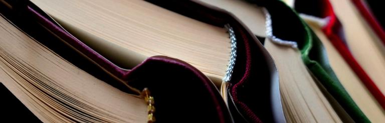 Stacked books with coloured spines