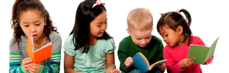 Four children sat on the floor looking at books